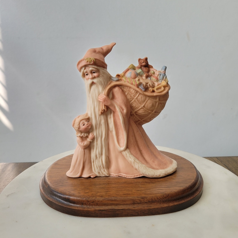 Vintage porcelain Santa in pink suit